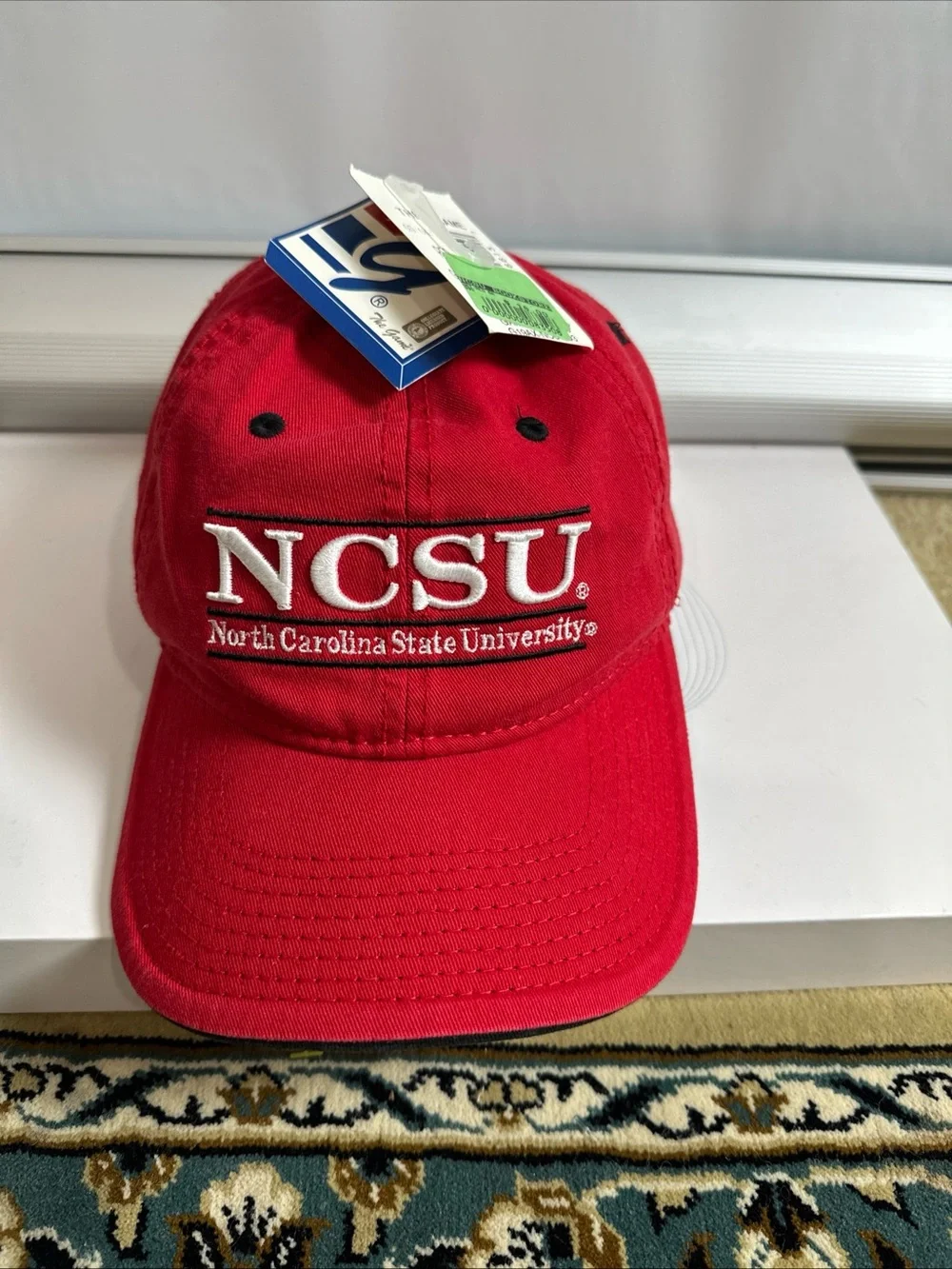 The Game Red Baseball Cap with White Embroidered Patch North Carolina State